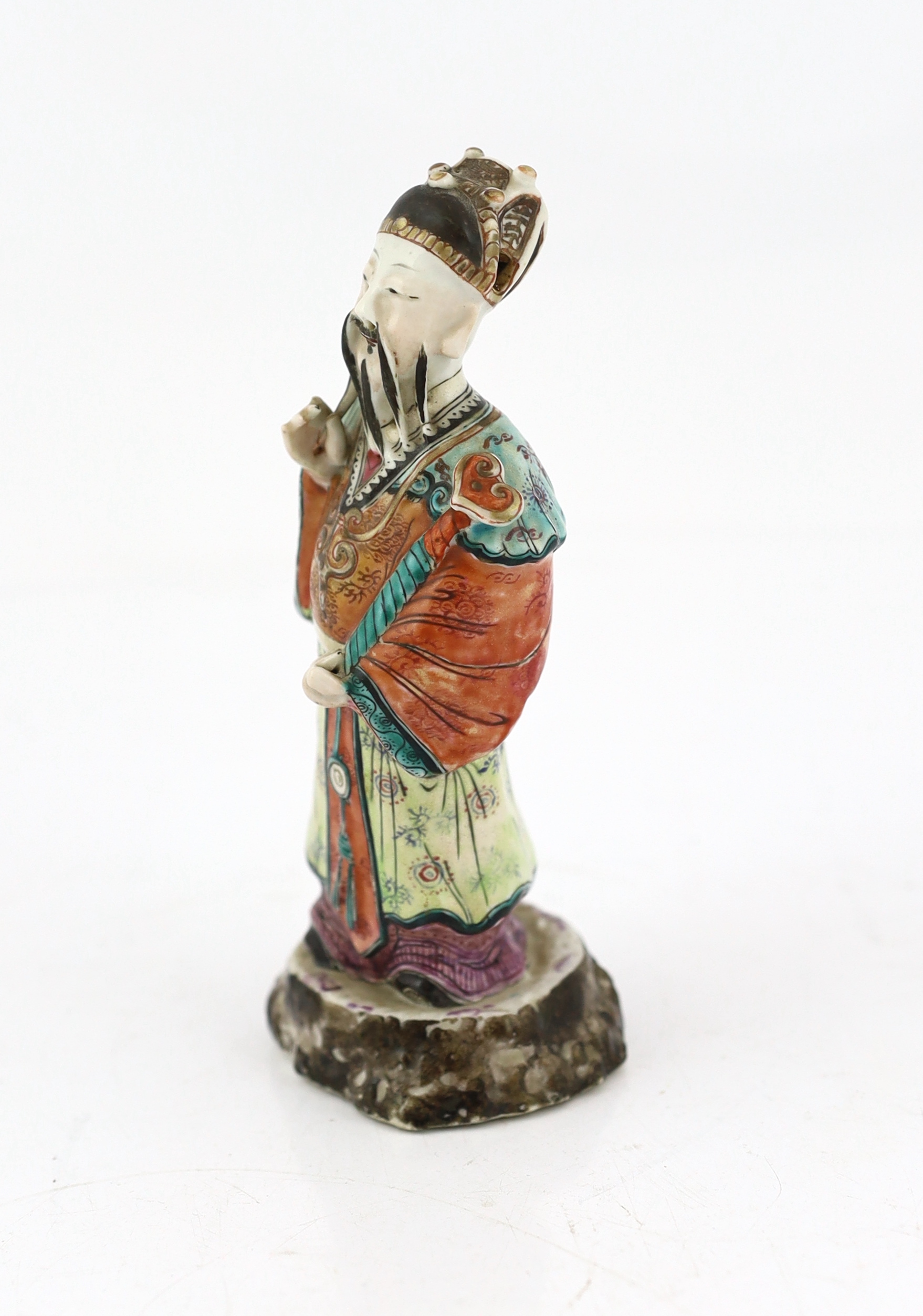 A Chinese enamelled porcelain figure of a court official, Jiaqing period (1796-1820), loss to right index finger